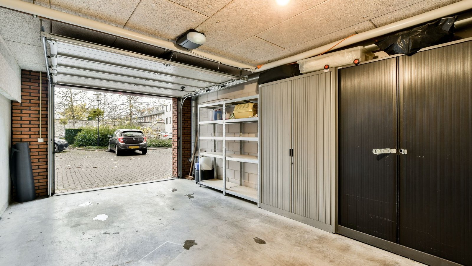What Causes A Garage Door To Open By Itself? And Here’s How to Fix It