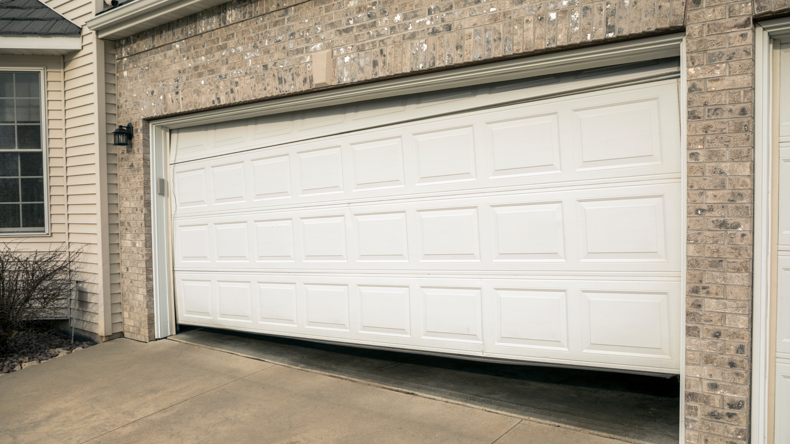 Why Your Garage Door Opens By Itself And How to Fix It Fast